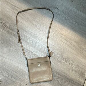 Coach Tan Crossbody Bag with Adjustable Strap and Gold Accents